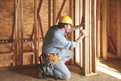 construction worker building a custom home